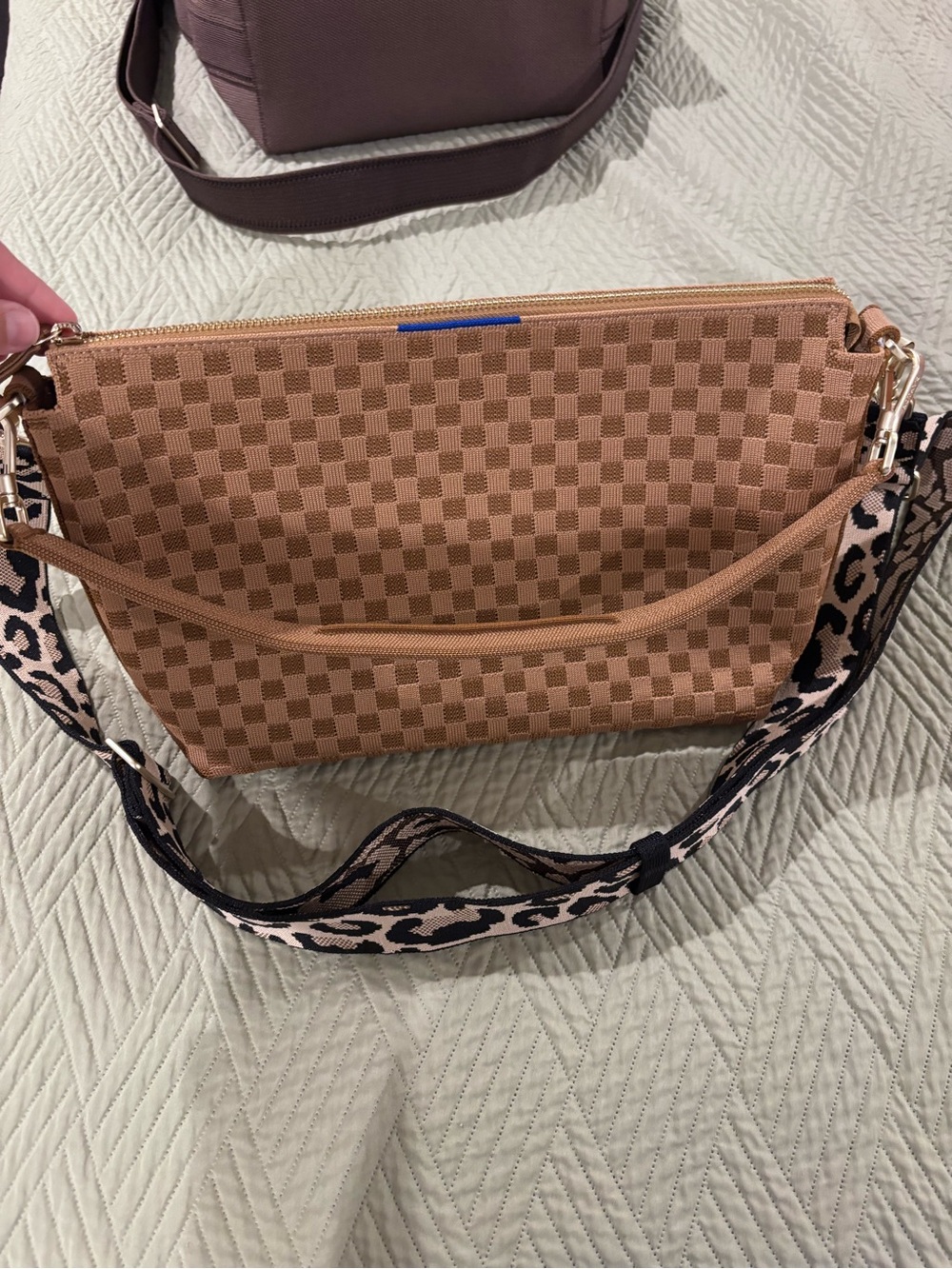 Rothy’s daily crossbody hazelnut with big cat strap